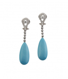 724.  Pendientes largos con grandes lágrimas de turquesas que penden de brillantes en lágrima superior y línea de chatones articulados