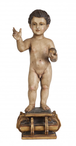 1138.  Niño Jesús Salvator Mundi.Escultura en madera tallada y policromada, siguiendo modelos del S. XVII .Trabajo español, S. XIX-XX.