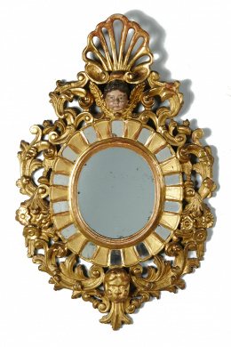 895.  Espejo ovalado en madera tallada, estucada, dorada y policromada.Trabajo español S. XVIII.