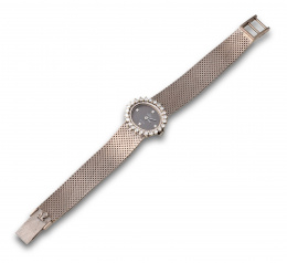 614.  Reloj de pulsera años 60 OMEGA de VILLE  en oro blanco de 18K orlado de brillantes.