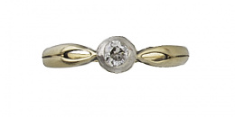 223.  Sortija en oro bicolor de 18K con brillante de 0,10 ct aprox