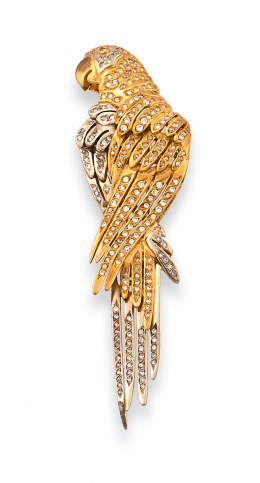 665.  Broche de brillantes en forma de ave exótica en oro bicolor de 18K.