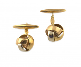 756.  Gemelos de nudo esférico en oro bicolor de 18K.