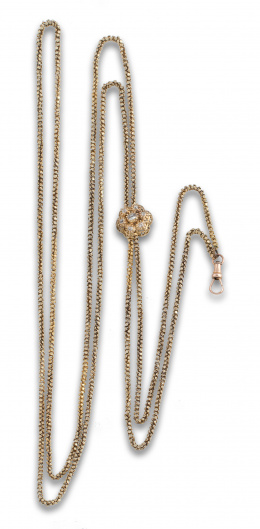 610.  Leontina s.XIX con cadena de cordón tubular de pequeñas flores; centro de pasador en forma de flor  con brillantes de talla antigua en torno a brillante talla cojín central.