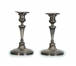 594.  Pareja de candeleros de plata en su color con vástago en estípite, S. XIX.