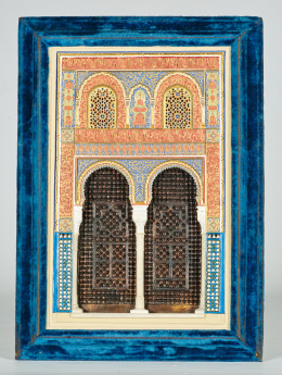 478.  Modelo de puerta de la Alhambra en yeso policromado y dorado y columnas de alabastro,marco de terciopelo azul. Escuela andaluza, ffs. del S. XIX.