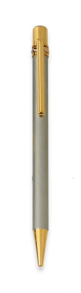 316.  Bolígrafo Must de CARTIER en acero y plaqué or con su estuche original.