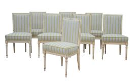 763.  Juego de ocho sillas de estilo Luis XVI de madera lacada de blanco y tapicería en azul a rayas verdes.S. XX.