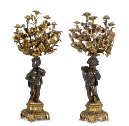 488.  Pareja de candelabros de nueve brazos de bronce dorado y bronce patinado.Trabajo francés, mediados del S. XIX..
