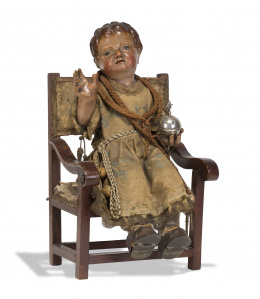 324.  Niño Jesús Salvator Mundi.Madera tallada, y policromada, con sillón frailero de nogal original.Escuela castellana, S. XVIII.
