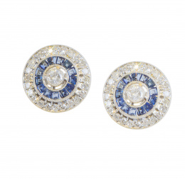 198.  Pendientes ojo de perdiz con brillante central orlado de zafiros calibrados y con otra orla exterior de brillantes
