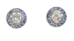 184.  Pendientes ojo de perdiz con brillantes centrales de 0,40 ct aprox orlados de zafiros calibrados.
