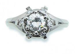 179.  Sortija rosetón con solitario brillante de 0,90 ct aprox rodeado por 6 brillantes
