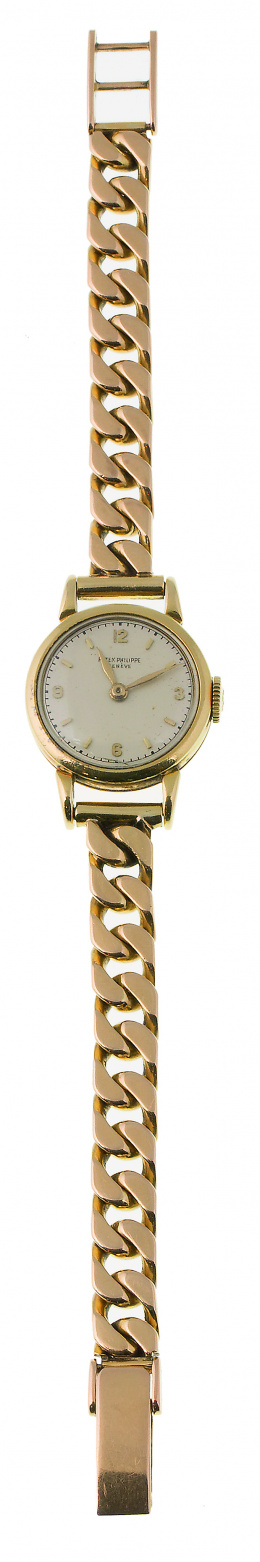823.  Reloj PATEK PHILLIPPE de señora años 30, en oro de 18K
