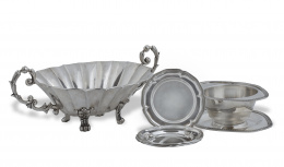 377.  Cuatro platos de pan en plata.Melleiro, París, S. XX.