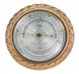 703.  Barómetro con marco de madera tallada y dorada. J. Sewill. Inglaterra, ffs. del S. XIX