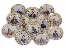 1099.  Juego de doce platos de porcelana esmaltada con personajes relevantes pintados.París, S. XIX.
