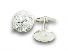 825.  Gemelos circulares HERMES en metal plateado.