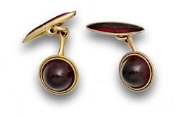 811.  Gemelos KREMENTZ años 40 con  cabujones de resina roja.