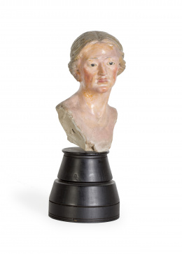 1045.  “Anciana”Cabeza de barro policromada, con ojos de pasta vítrea.Trabajo napolitano, S. XVIII.