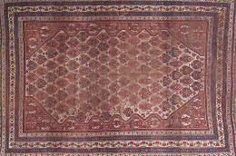 616.  Antigua alfombra neyriz en tonos granates.Trabajo persa, h. 1860.