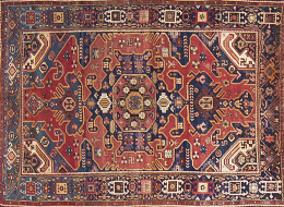 1080.  Alfombra en lana Kazak de campo azul y cartuchos en rojoTrabajo caucásico, c. 1920