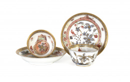 1087.  Dos tazas y dos platos de porcelana esmaltada y dorada de estilo Imari.Alemania, S. XVIII.