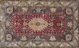 617.  Alfombra en seda de campo granate con cartucho central, palmetas, piñas y flores, cenefa en azul con pájaros.Persia.