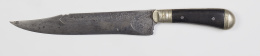 1131.  Cuchillo Solingen en acero grabado y mango de madera y metal.Alemania, S. XIX.