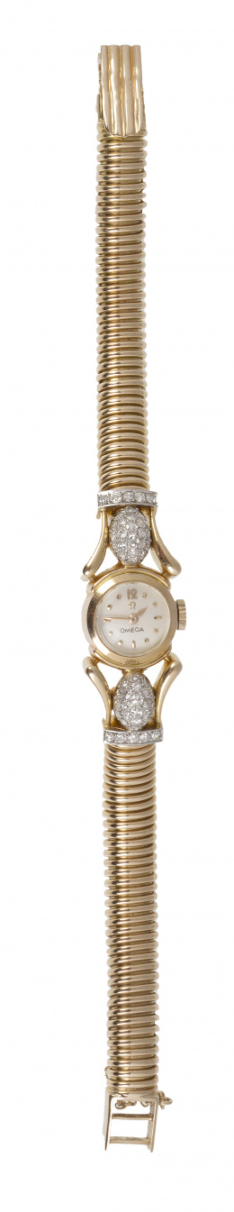 397.  Reloj OMEGA años 40 con pulsera tubo de gas y brillantes en motivos ovales y bandas flanqueando la caja 