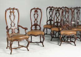 1035.  Juego de doce sillas y dos sillones, de madera de nogal.Quizás trabajo mallorquín, S. XVIII.