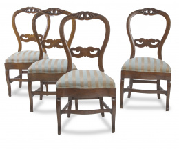 727.  Lote de cuatro sillas de madera de nogal tallado.Mallorca, mediados del S. XIX.