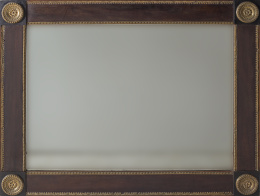 1193.  Espejo fernandino de caoba con bronce aplicado.Trabajo español, S. XIX