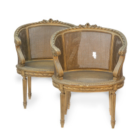 1304.  Pareja de bergeres de madera dorada y asiento de estilo Luis XVI.España, h. 1900.