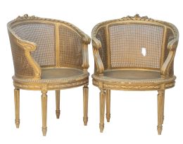 1304.  Pareja de bergeres de madera dorada y asiento de estilo Luis XVI.España, h. 1900.