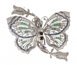 158.  Broche con diseño de mariposa de estilo Art-Decó con brillantes, esmeraldas, ónix y zafiros calibrados