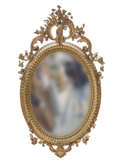 1147.  Espejo de madera tallada y dorada, rematada por un angelito.Trabajo español, h. 1900.