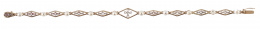 78.  Pulsera de pp. S. XX con delicado diseño de piezas romboidales caladas con diamantes, y entre ellas perlas finas