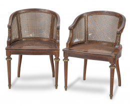 999.  Pareja de bergeres de estilo Luis XVI con asiento cané.h. 1900.