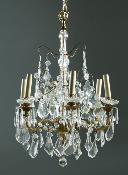 491.  Lámpara de bronce y cristal, con vástago abalaustrado y pandelocas.S. XIX.