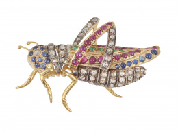117.  Broche con diseño de saltamontes realizado con diamantes de talla rosa, y cabuchones de rubíes, esmeraldas y zafiros. 