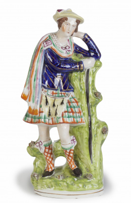 1101.  “Escocés”.Figura de loza esmaltada.Staffordshire, Inglaterra, S. XIX.