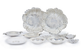 790.  Lote de ceniceros en plata: pareja de gallonados, cinco con monedas, y seis pequeños en formade hoja.