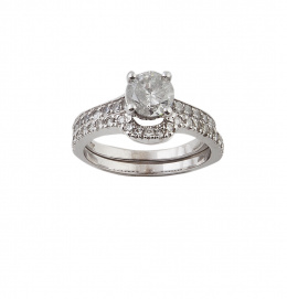 173.  Doble sortija de brillantes, con solitario de brilllante en uno de los anillos de brillantes 