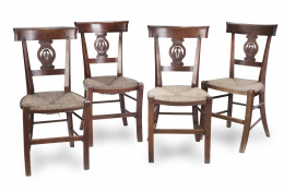 479.  Juego de ocho sillas en madera de caoba con asiento de enea.Trabajo francés, primera mitad del S. XIX.
