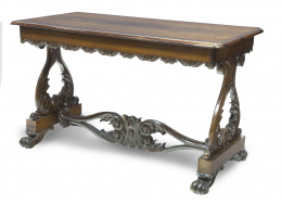 1150.  "Sofá table" de madera de palosanto tallada.Inglaterra, mediados del S. XIX.