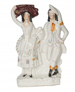 712.  Pareja de figuras de loza esmaltada.Staffordshire, Inglaterra, ff. del S. XIX.