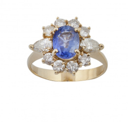 287.  Sortija estilo Lady Di con zafiro Ceylan central oval, orlado de brillantes y con diamantes talla perilla en los laterales