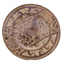 1037.  Plato en cerámica de reflejo metálico con ave.Manises, S. XVI.