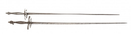 1129.  Lote de dos espadas, una con empuñadura de hierro, la otra de acero.Toledo, S. XIX.